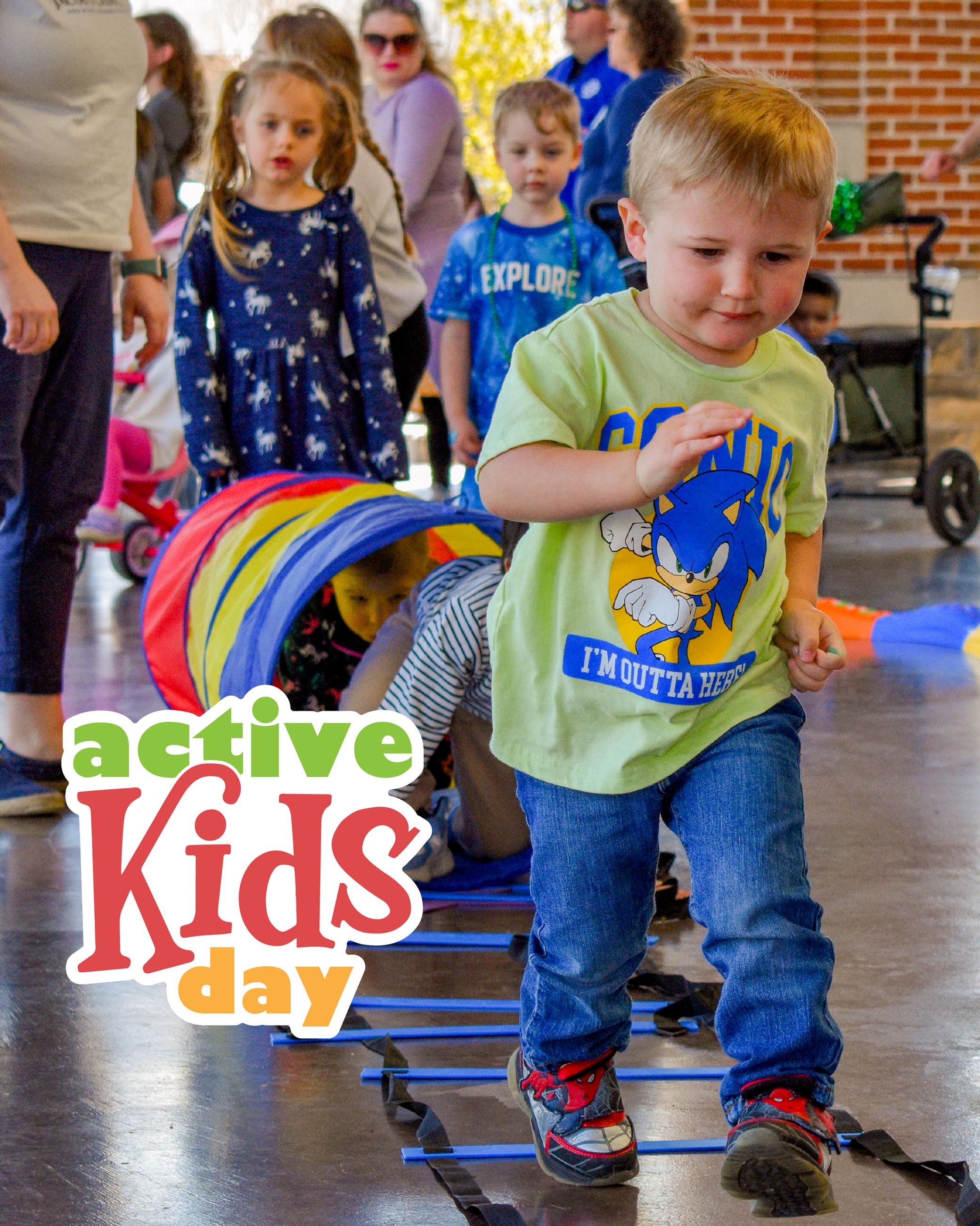 Child running forward with more children waiting in line, and the Active Kids Day logo in a corner